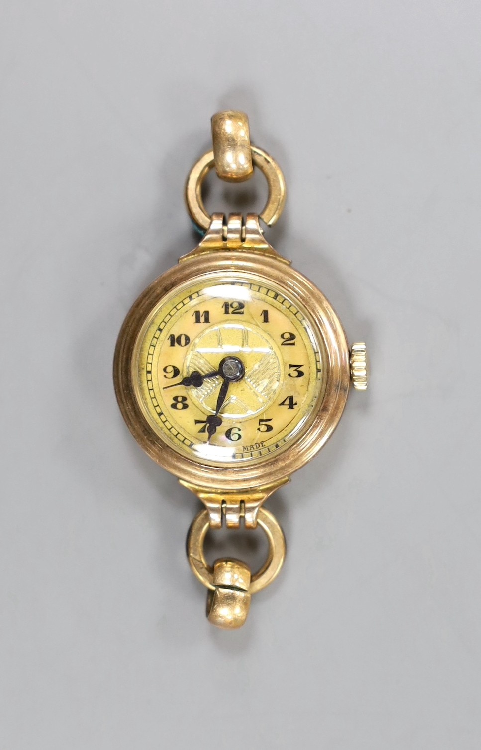 A lady's 9ct gold manual wind wrist watch, no strap, gross 9.5 grams.